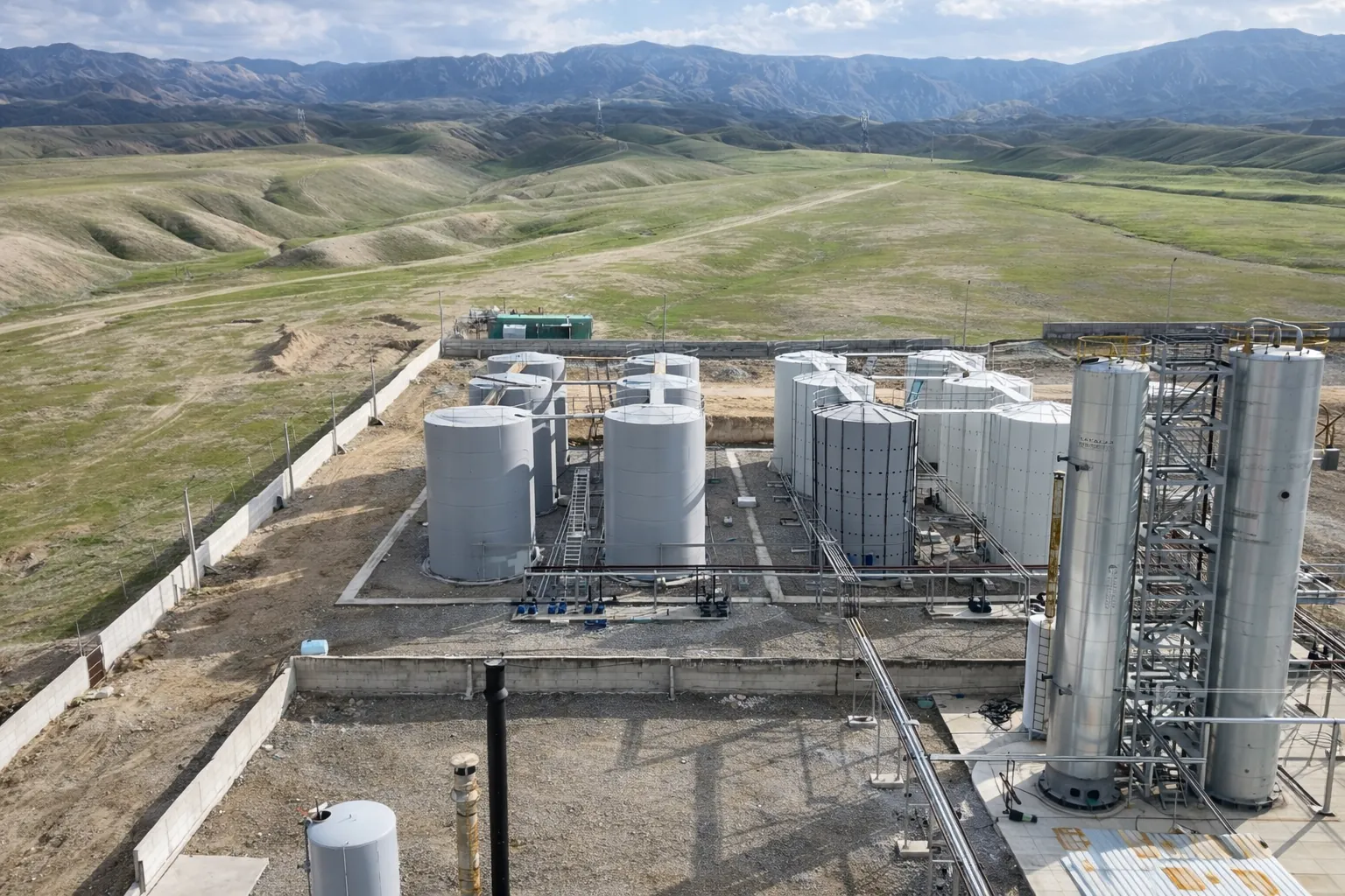 Wide angle refinery view with green landscape
